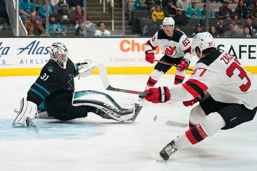 Couture scores in OT as Sharks top Devils